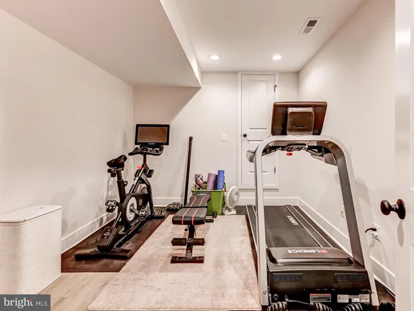 a bedroom with furniture and a flat screen tv