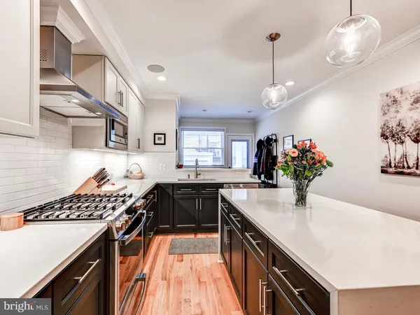 a kitchen with a sink and stove