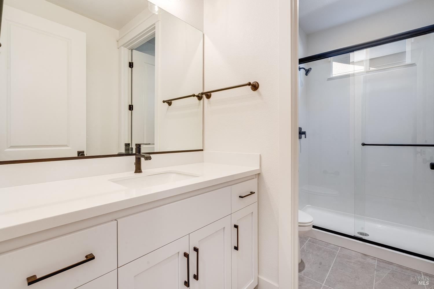 3461 Ruston Lane Napa, CA 94558 - Photo 8 of 22 a view of a bathroom with a sink and a mirror