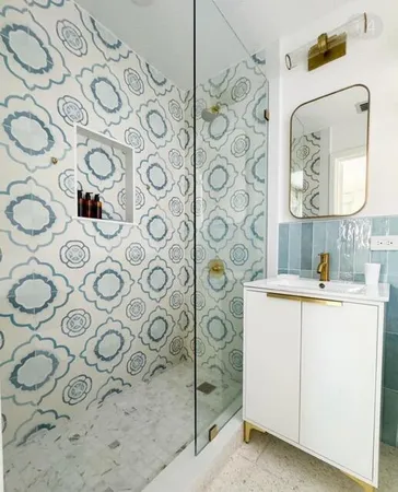 a bathroom with a sink and mirror with painted walls