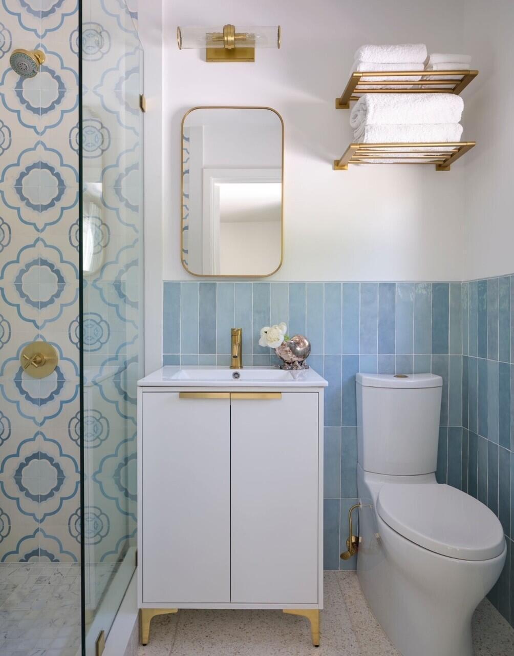 255 Cortez Road West Palm Beach, FL 33405 - Photo 14 of 24 a bathroom with a toilet sink and mirror