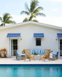 a view of swimming pool with outdoor seating