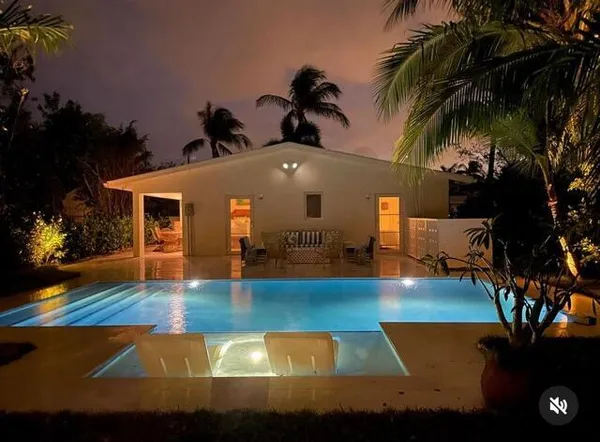 a view of a house with swimming pool