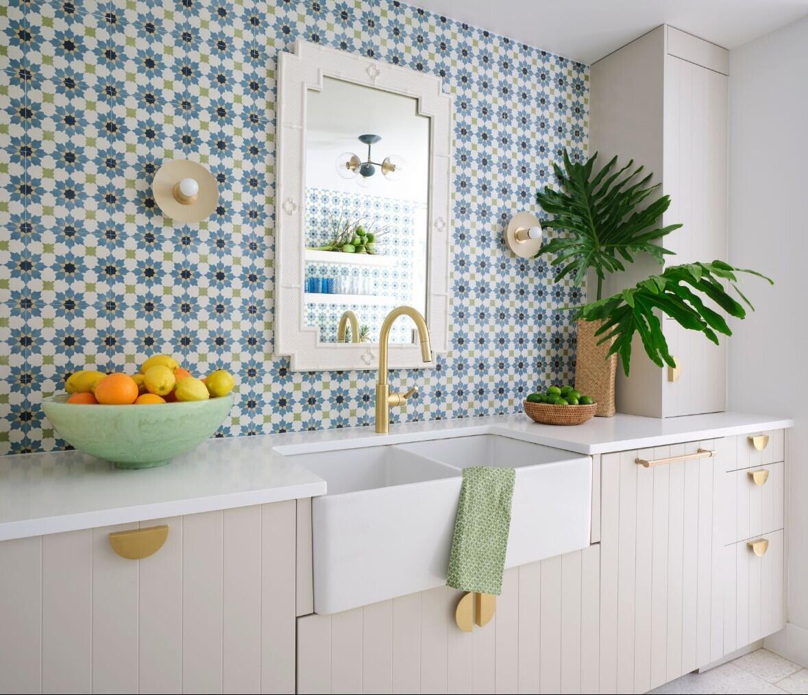 255 Cortez Road West Palm Beach, FL 33405 - Photo 9 of 24 a kitchen with a sink a potted plant and a large window