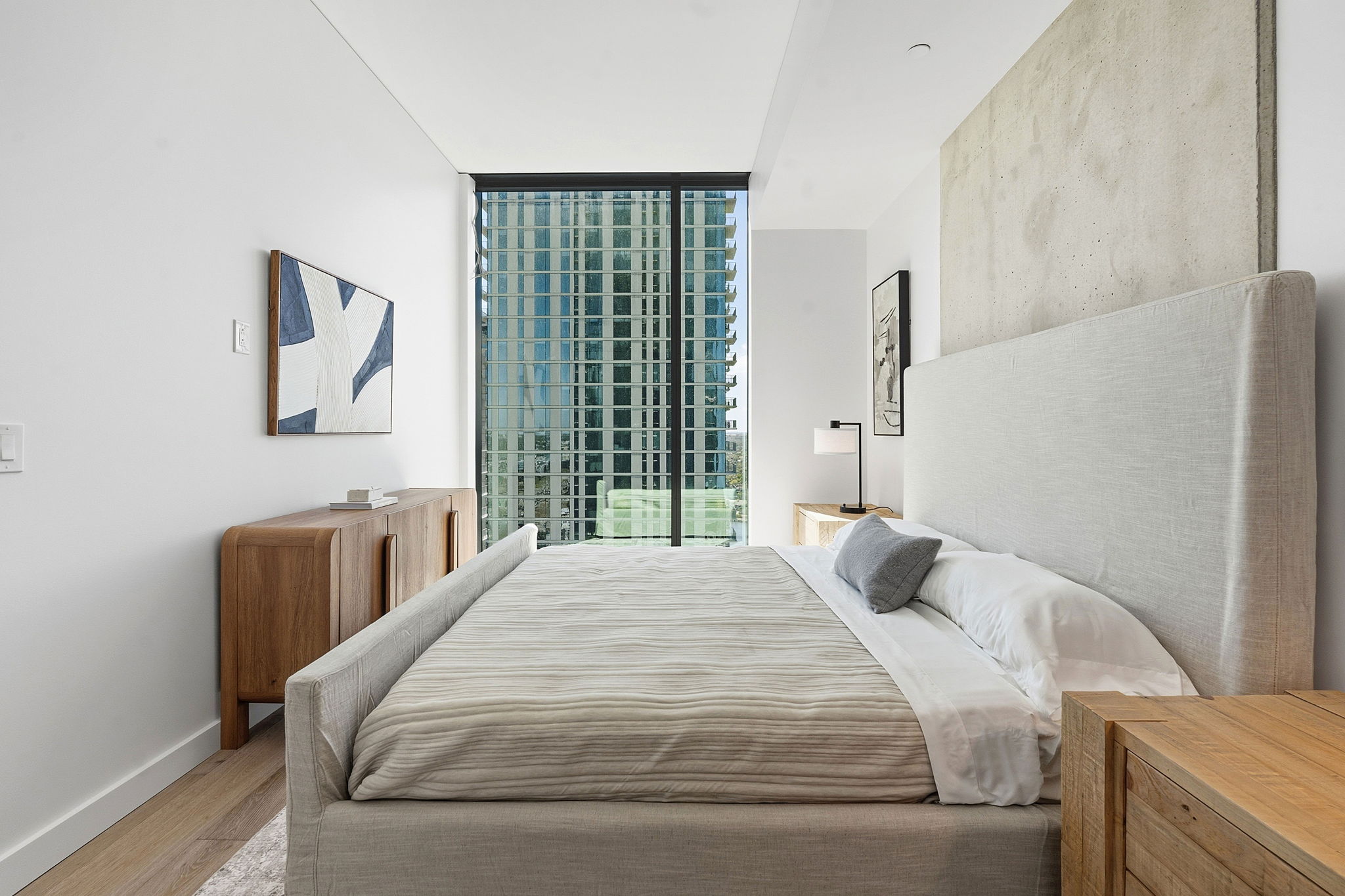 610 Davis Street, Unit 3004 Austin, TX 78701 - Photo 17 of 40 Bedroom with wood finished floors, floor to ceiling windows, and access to outside