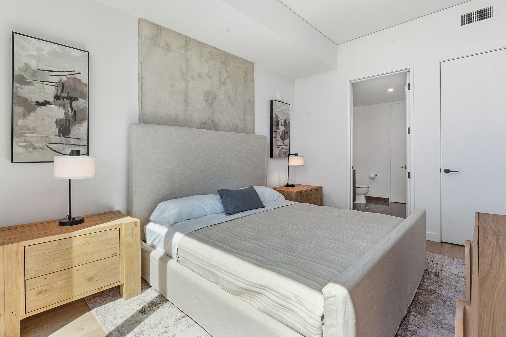 610 Davis Street, Unit 3004 Austin, TX 78701 - Photo 18 of 40 Bedroom featuring connected bathroom and wood finished floors