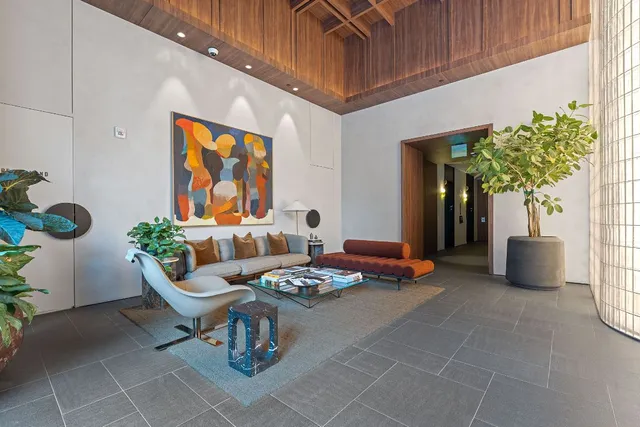 a building outdoor space with patio furniture and potted plants