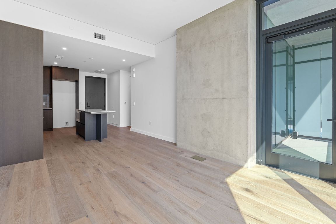 610 Davis Street, Unit 3004 Austin, TX 78701 - Photo 2 of 40 a bedroom with a bed and a window