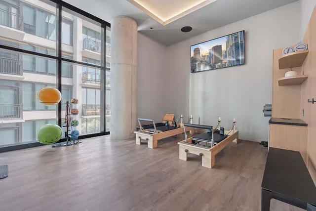 a living room with furniture and wooden floor