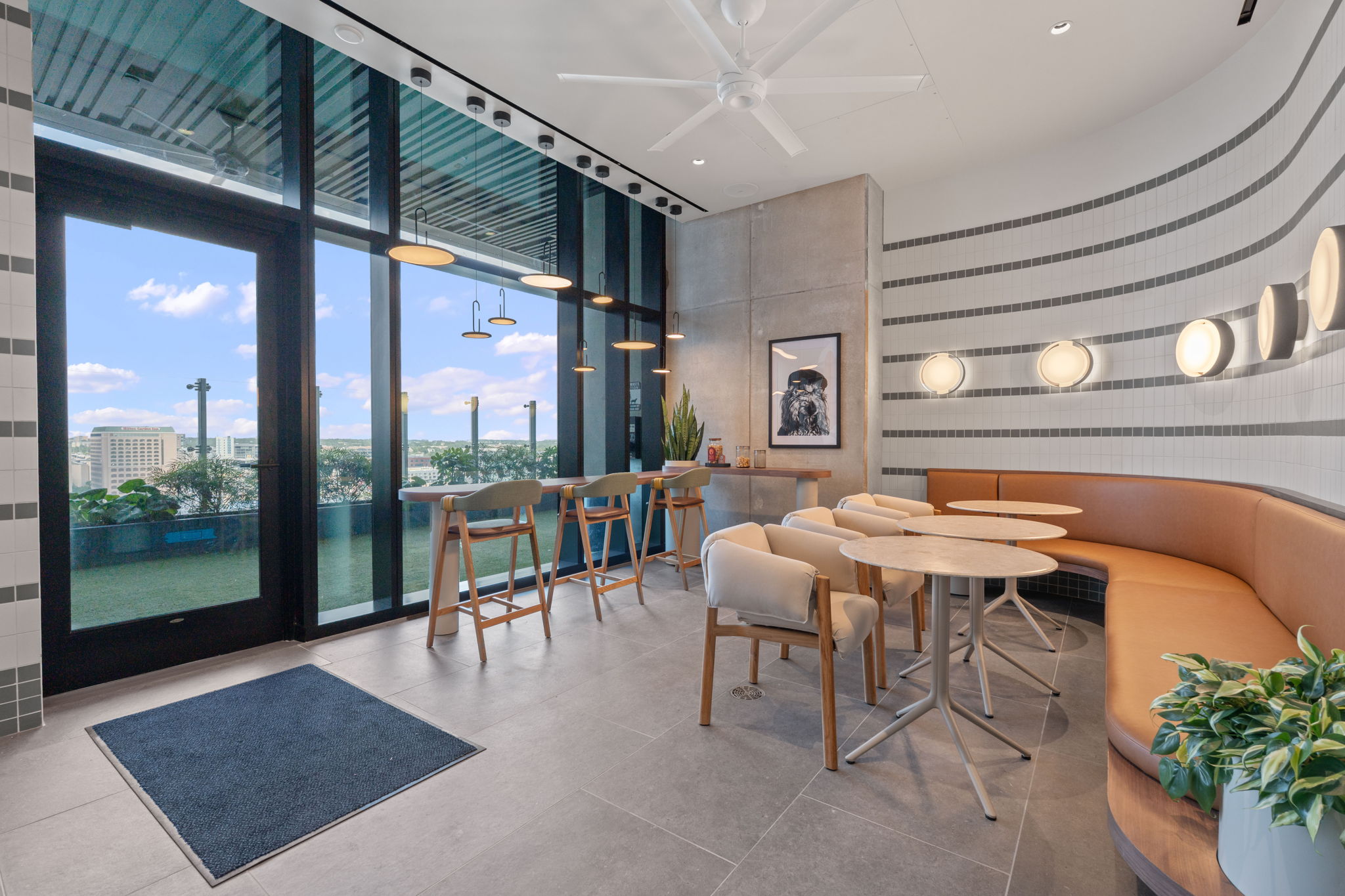610 Davis Street, Unit 3004 Austin, TX 78701 - Photo 29 of 40 Community lobby with expansive windows, recessed lighting, and wallpapered walls