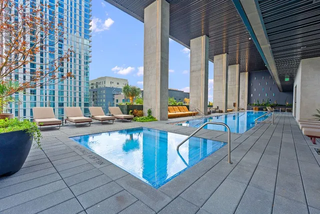 a view of swimming pool with outdoor seating