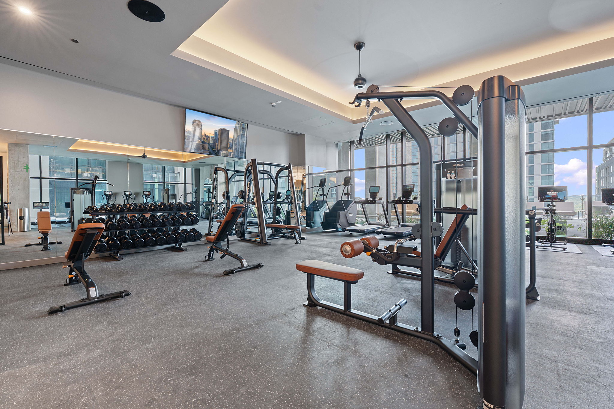 610 Davis Street, Unit 3004 Austin, TX 78701 - Photo 31 of 40 Exercise room with a raised ceiling and floor to ceiling windows