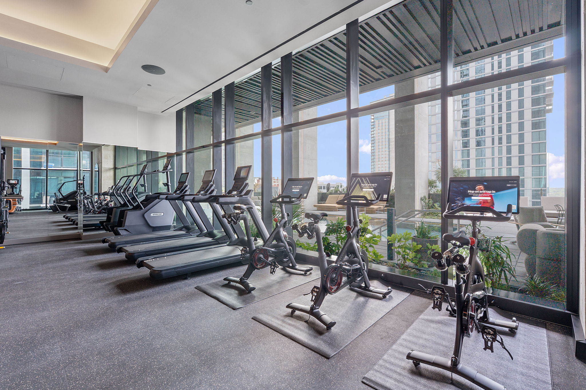 610 Davis Street, Unit 3004 Austin, TX 78701 - Photo 32 of 40 Gym with floor to ceiling windows