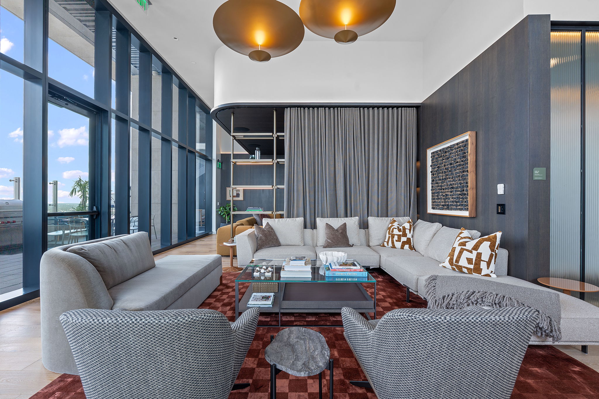 610 Davis Street, Unit 3004 Austin, TX 78701 - Photo 40 of 40 Living room featuring wood finished floors, a wall of windows, and a towering ceiling