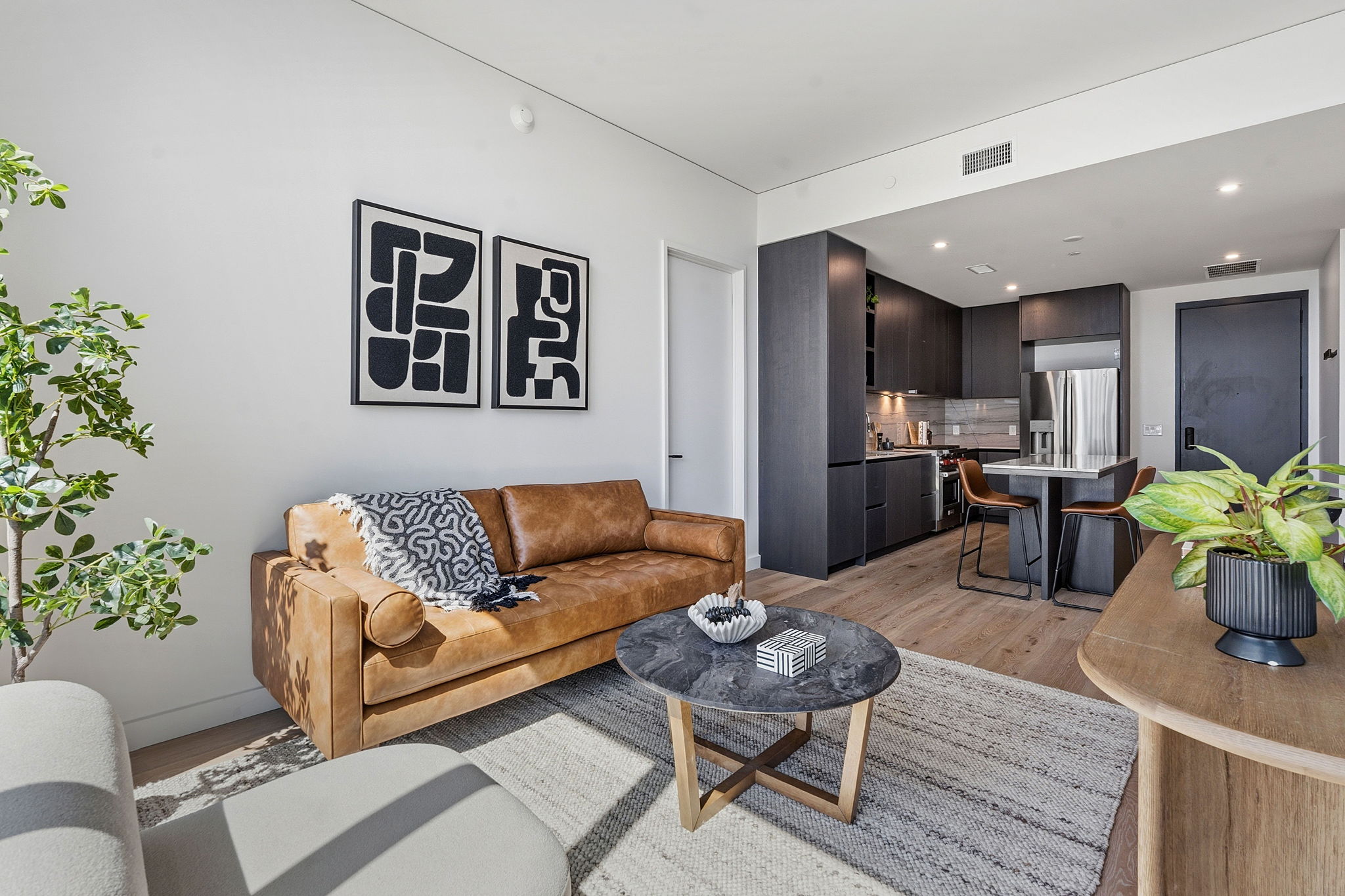 610 Davis Street, Unit 3004 Austin, TX 78701 - Photo 4 of 40 Living room featuring light wood-type flooring and recessed lighting