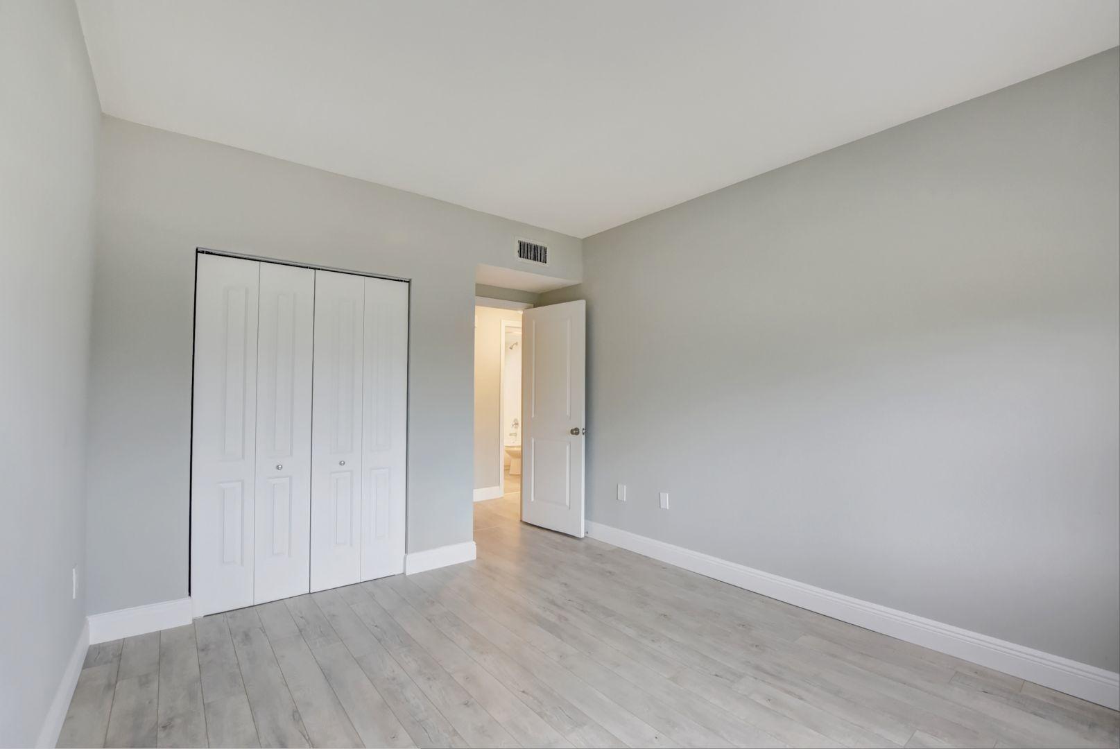 290 West Palmetto Park Road, Unit 304 Boca Raton, FL 33432 - Photo 13 of 27 a view of an empty room and wooden floor