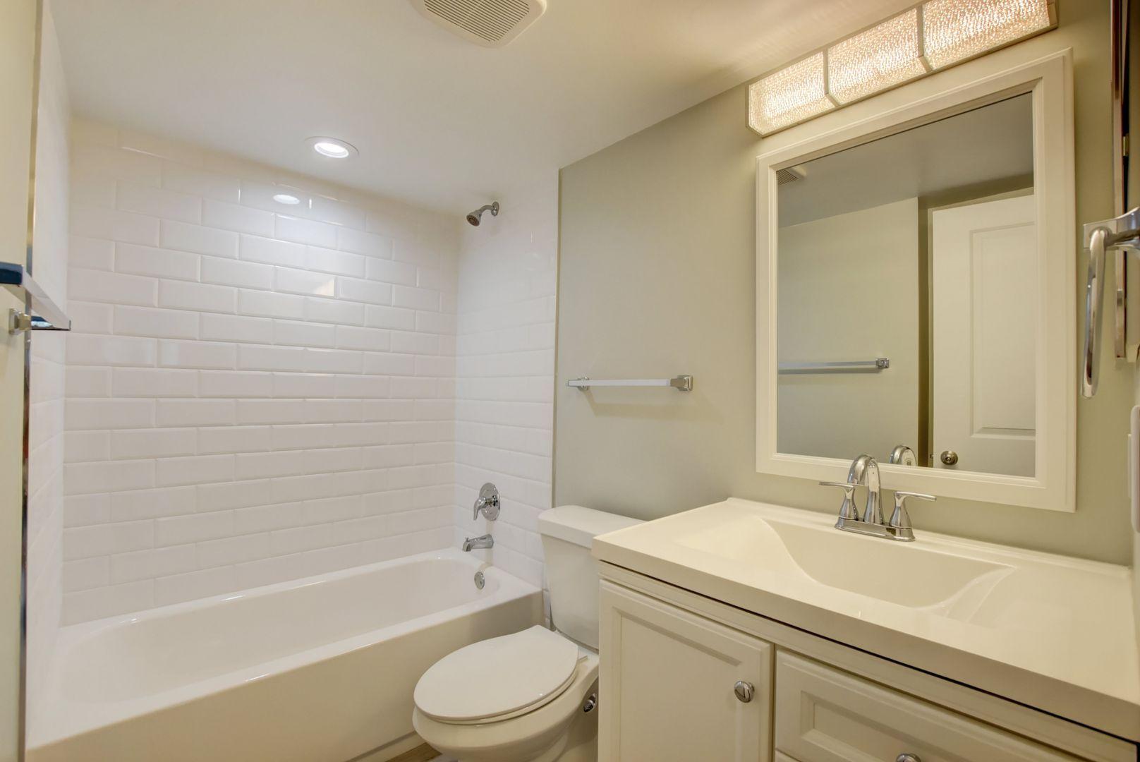 290 West Palmetto Park Road, Unit 304 Boca Raton, FL 33432 - Photo 18 of 27 a bathroom with a sink a toilet and a bathtub