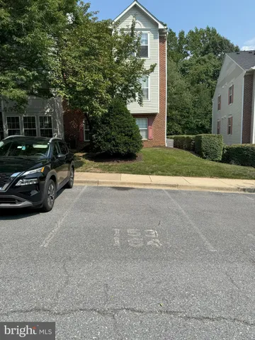 a view of a car parked on the side of a road