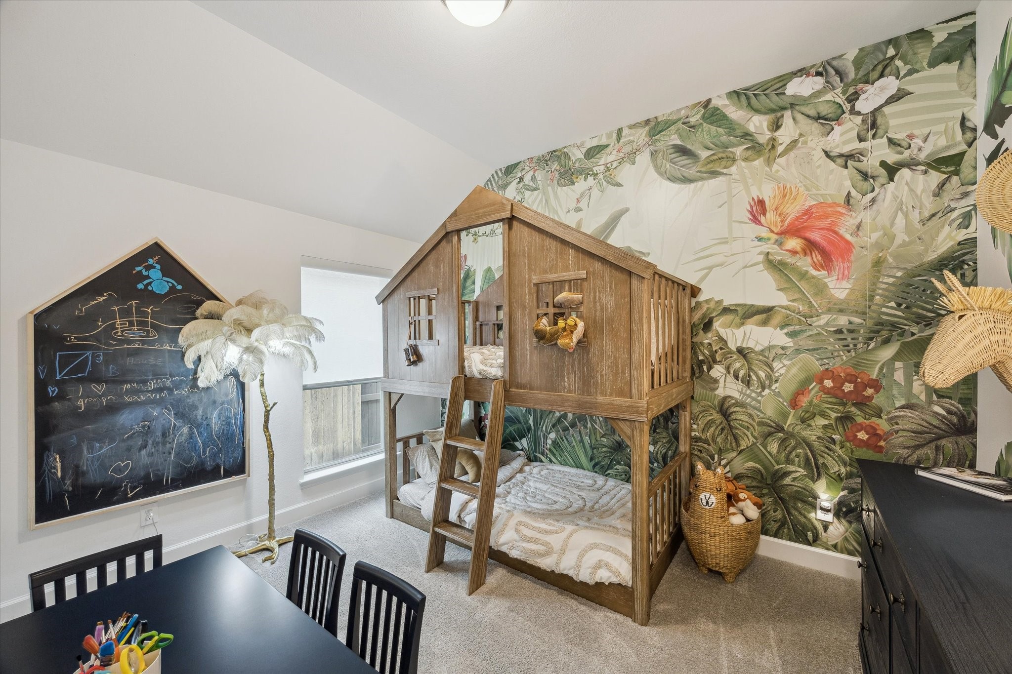 9823 Chapman Trail Manvel, TX 77578 - Photo 26 of 47 What fun! Bedroom three showcases the most beautiful tropical wallpaper in soft, muted tones.