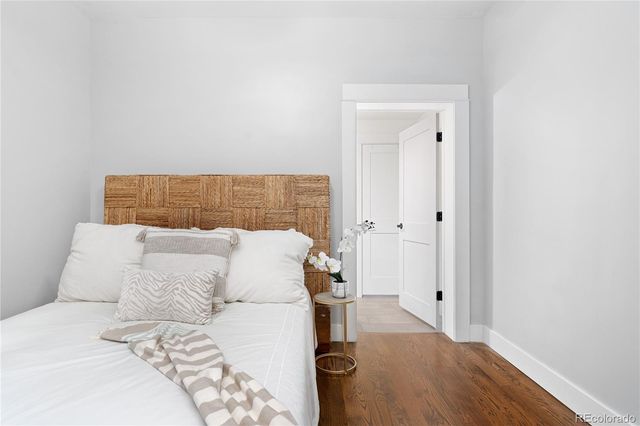 a bedroom with a bed and a mirror