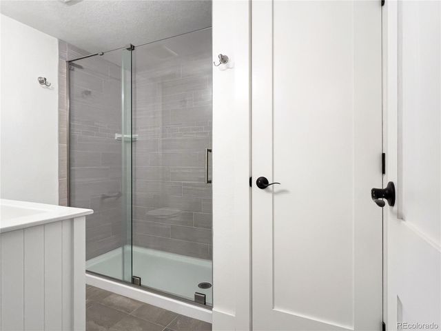 a bathroom with a shower and a toilet