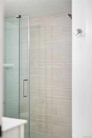 a backyard of a house with a garden and barbeque oven