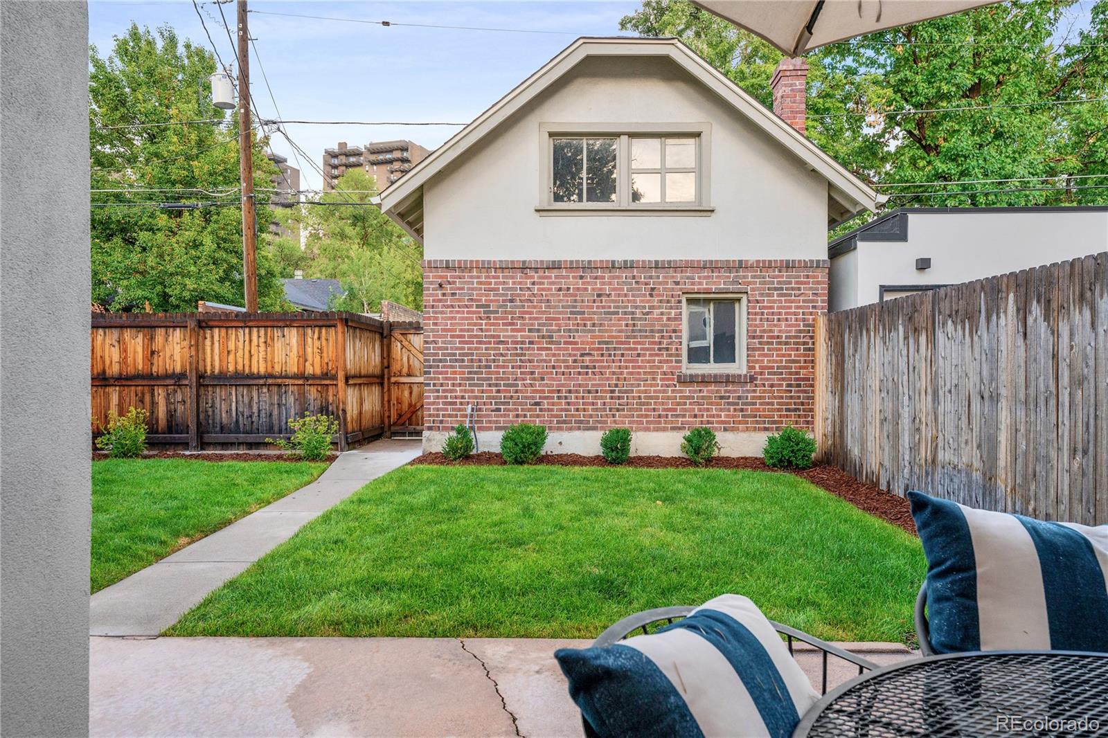 486 South Corona Street Denver, CO 80209 - Photo 34 of 46 a view of outdoor space yard and front view of a house