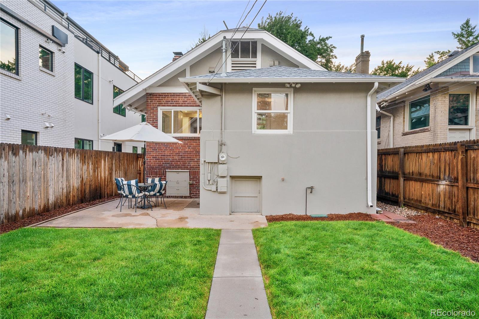 486 South Corona Street Denver, CO 80209 - Photo 35 of 46 a view of a house with a yard and sitting area