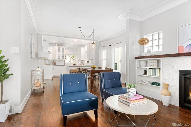 a living room with stainless steel appliances kitchen island granite countertop furniture and a kitchen view