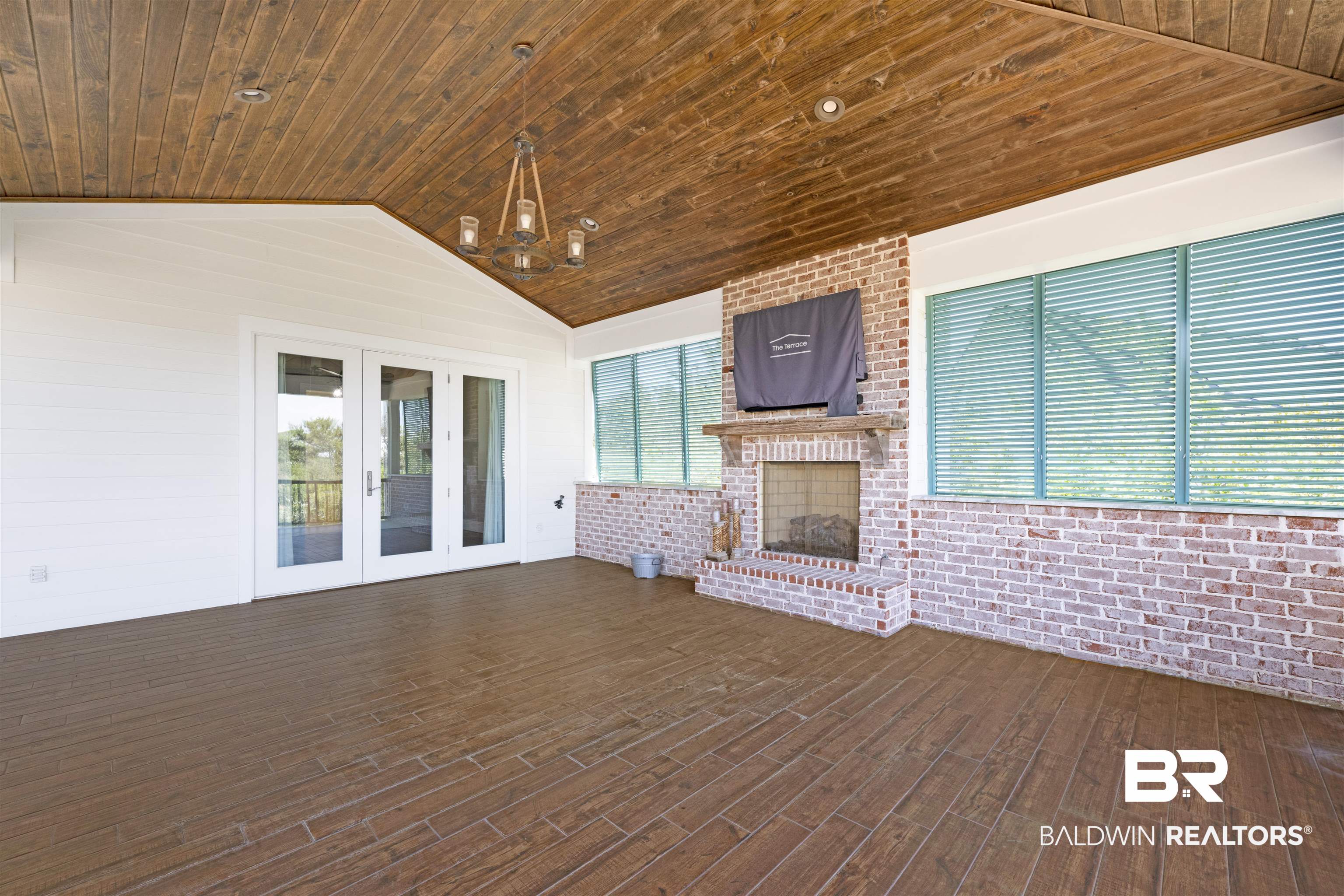 31729 River Road Orange Beach, AL 36561 - Photo 44 of 54 Deck with a fireplace and french doors