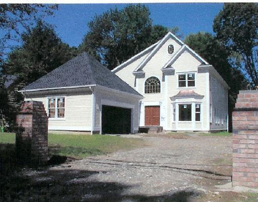 1693 Boston Post Road Darien, CT 06820 - Photo 1 of 1 a front view of a house with a yard and garage