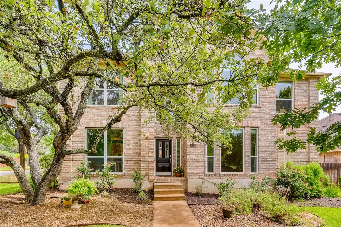 10822 Redmond Road Austin, TX 78739 - Photo 1 of 1 front view of a house with a trees