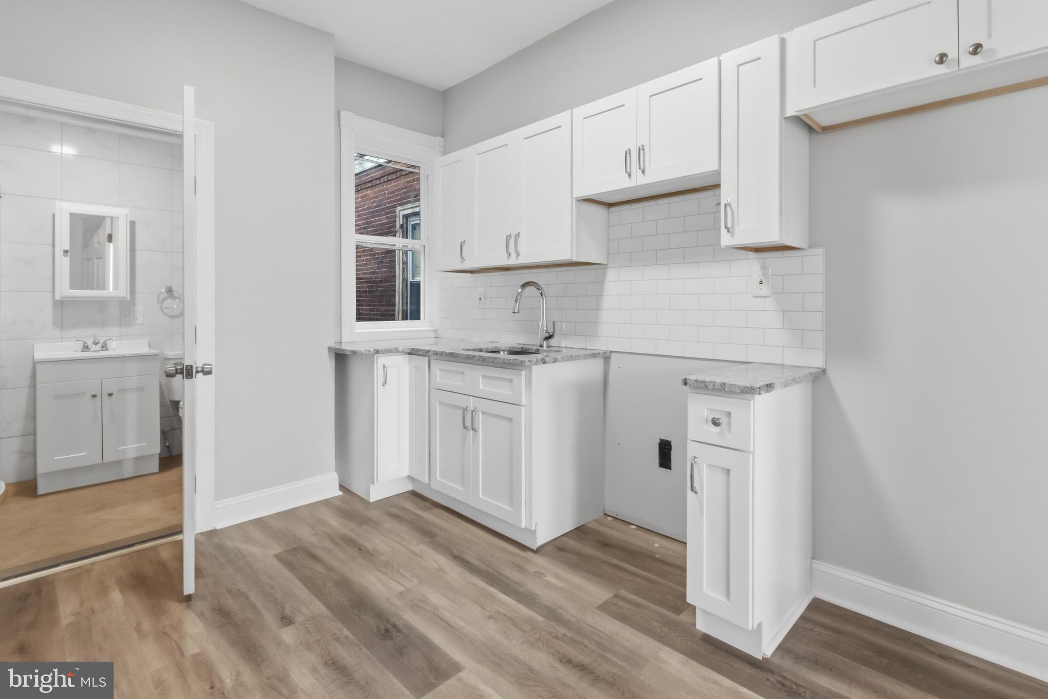 3545 North 11th Street, Unit 2F Philadelphia, PA 19140 - Photo 6 of 10 a kitchen with stainless steel appliances granite countertop a refrigerator and a stove