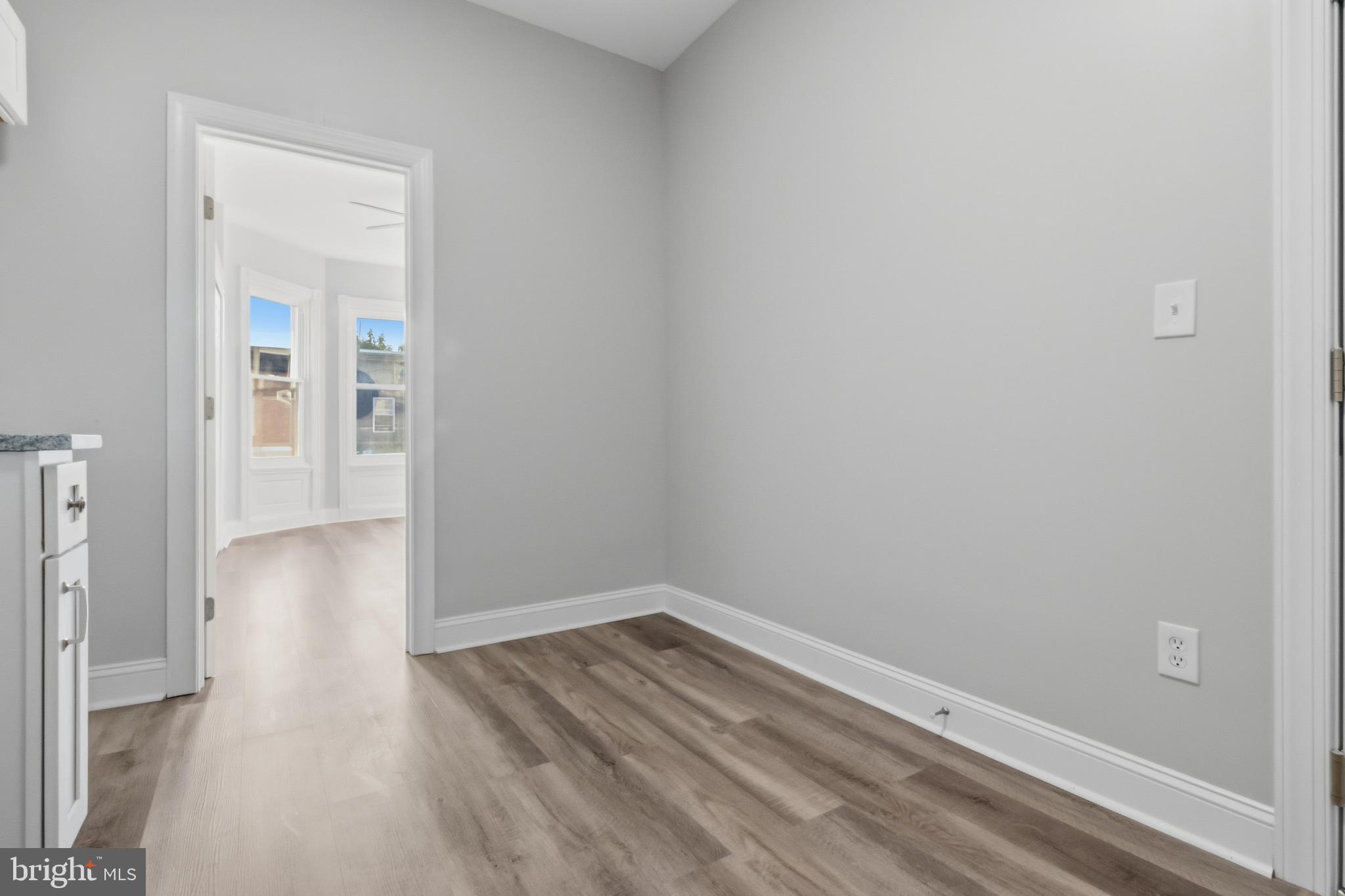 3545 North 11th Street, Unit 2F Philadelphia, PA 19140 - Photo 8 of 10 a view of a small space with wooden floor and a window