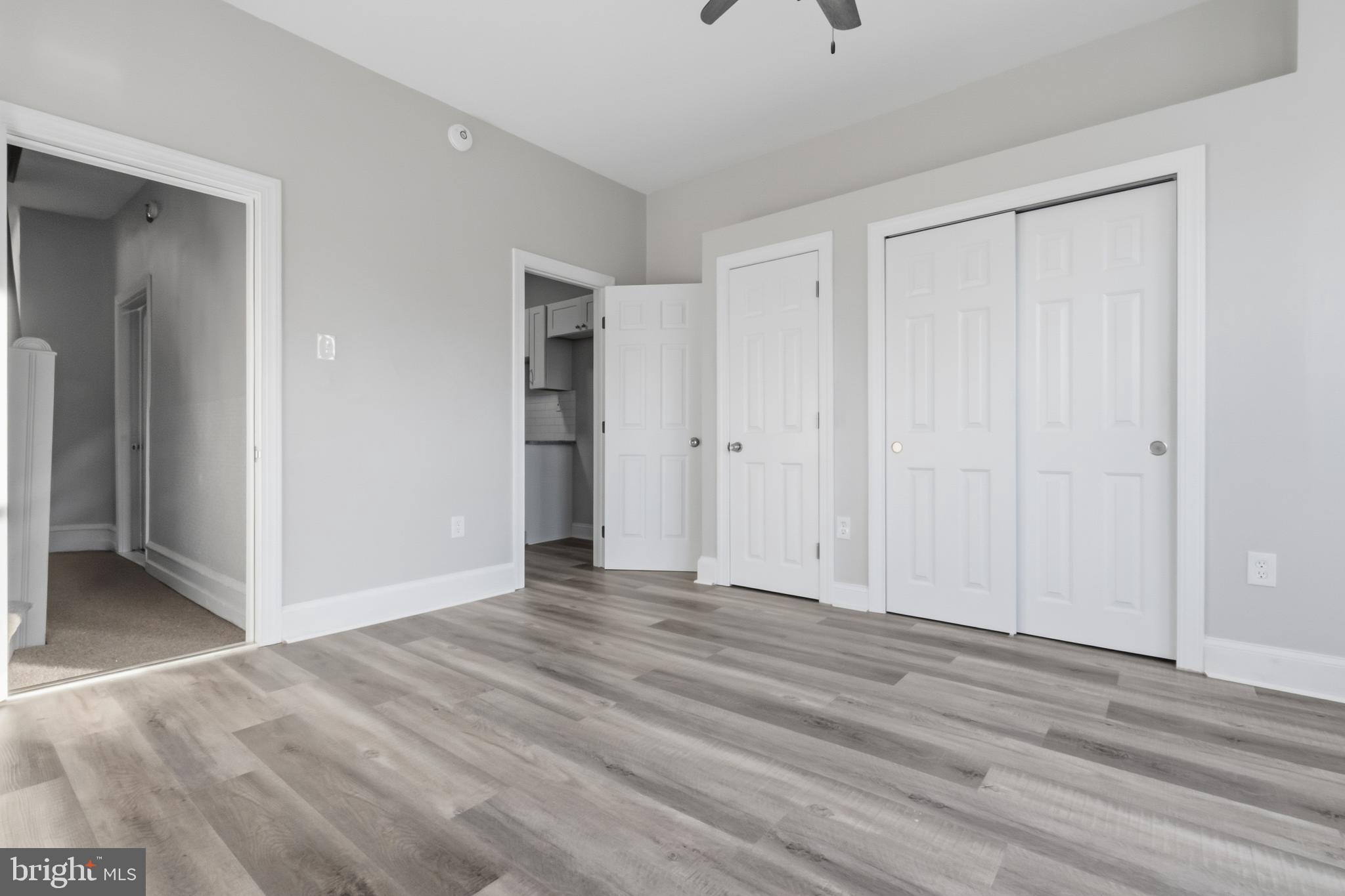 3545 North 11th Street, Unit 2F Philadelphia, PA 19140 - Photo 9 of 10 a view of an empty room with wooden floor