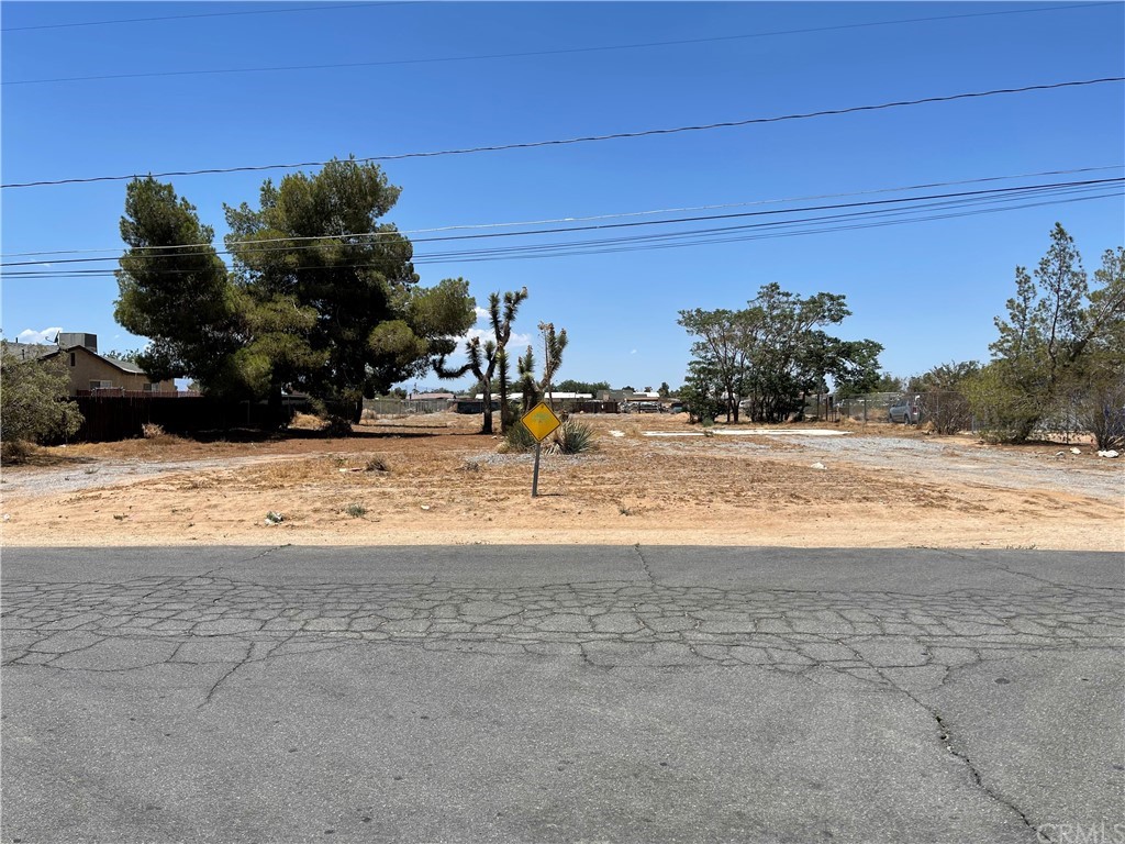 12250 Quinnault Road Apple Valley, CA 92308 - Photo 1 of 1 a view of swimming pool with a yard
