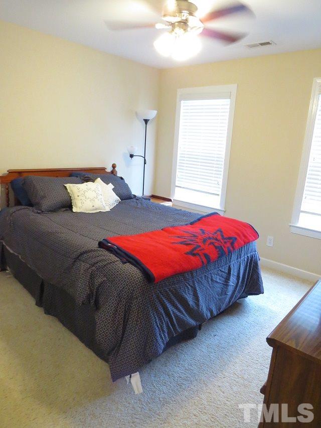 235 Steve Ridge Willow Spring, NC 27592 - Photo 15 of 25 a bedroom with a bed and window