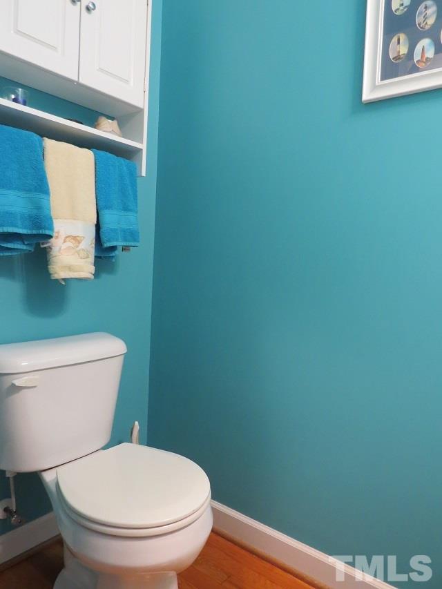 235 Steve Ridge Willow Spring, NC 27592 - Photo 16 of 25 a white toilet sitting next to a small bathroom