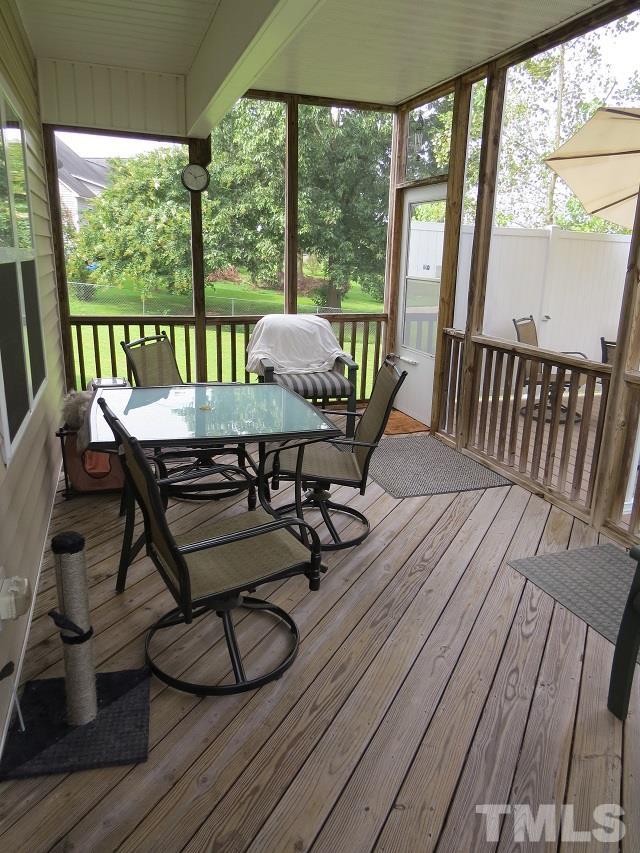 235 Steve Ridge Willow Spring, NC 27592 - Photo 20 of 25 a view of a dining room with furniture and wooden floor