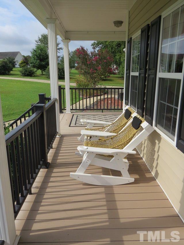235 Steve Ridge Willow Spring, NC 27592 - Photo 3 of 25 a view of swimming pool with garden and patio