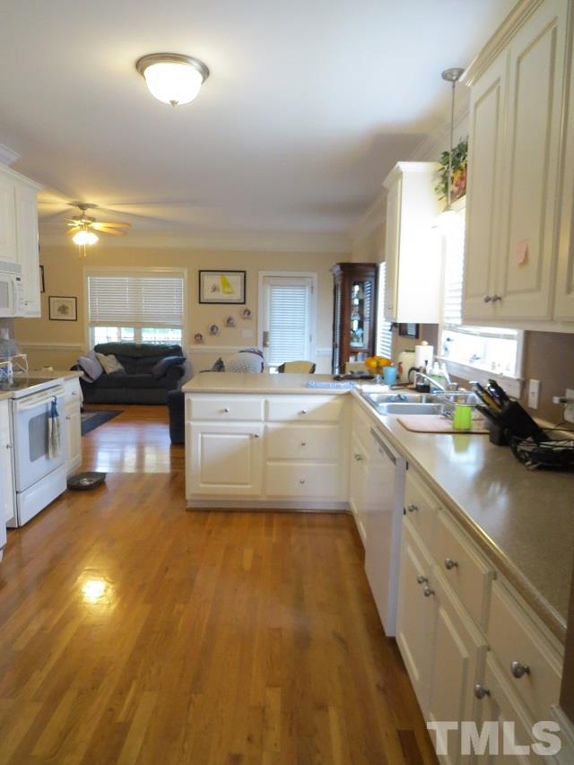 235 Steve Ridge Willow Spring, NC 27592 - Photo 4 of 25 a kitchen with a sink cabinets and window