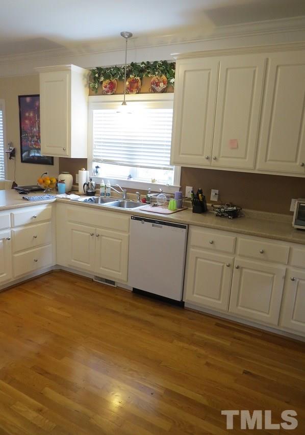 235 Steve Ridge Willow Spring, NC 27592 - Photo 5 of 25 a kitchen with granite countertop a sink and cabinets