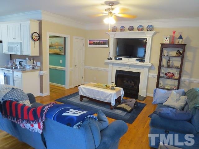 235 Steve Ridge Willow Spring, NC 27592 - Photo 8 of 25 a living room with furniture and a flat screen tv
