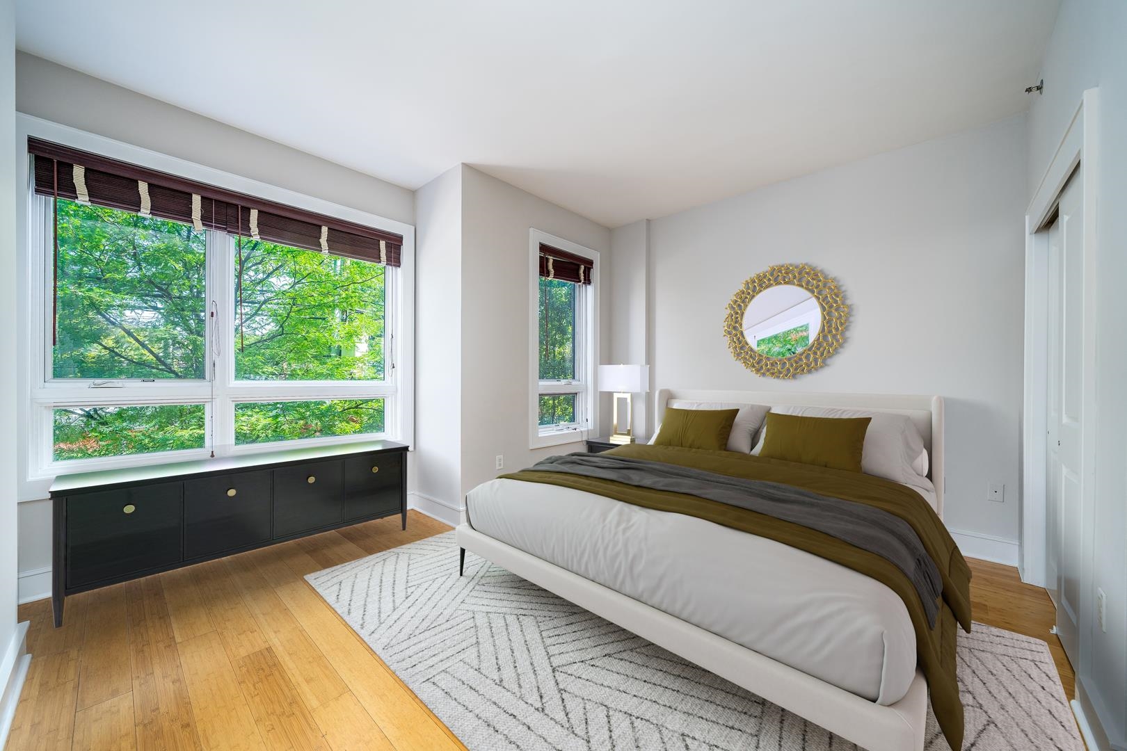 924 Jefferson Street, Unit 2A Hoboken, NJ 07030 - Photo 12 of 20 a bed sitting in a bedroom next to a window