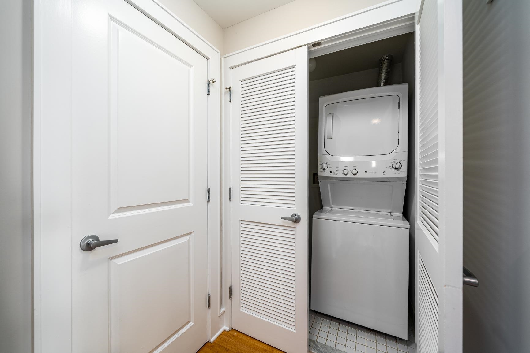 924 Jefferson Street, Unit 2A Hoboken, NJ 07030 - Photo 15 of 20 a view of a hallway with washer and dryer