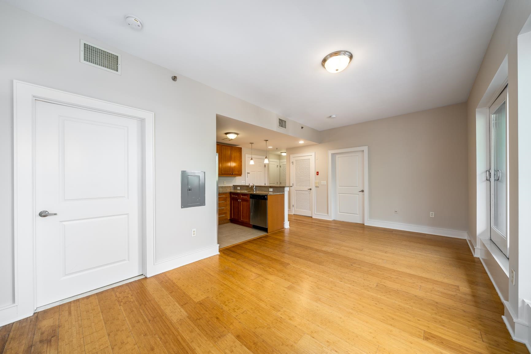 924 Jefferson Street, Unit 2A Hoboken, NJ 07030 - Photo 4 of 20 a view of a kitchen with a sink and a refrigerator