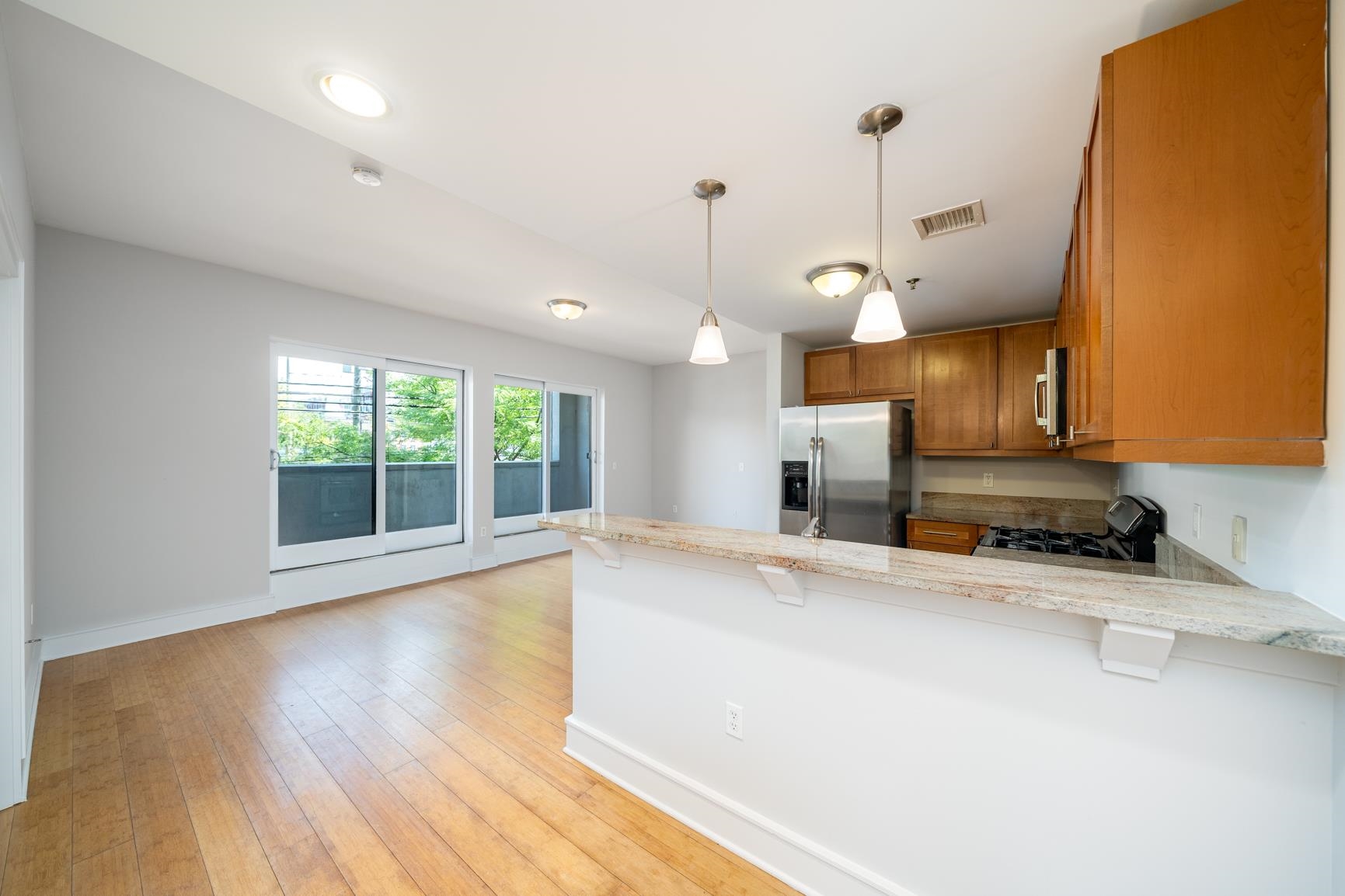 924 Jefferson Street, Unit 2A Hoboken, NJ 07030 - Photo 7 of 20 a view of a kitchen with a sink and a window