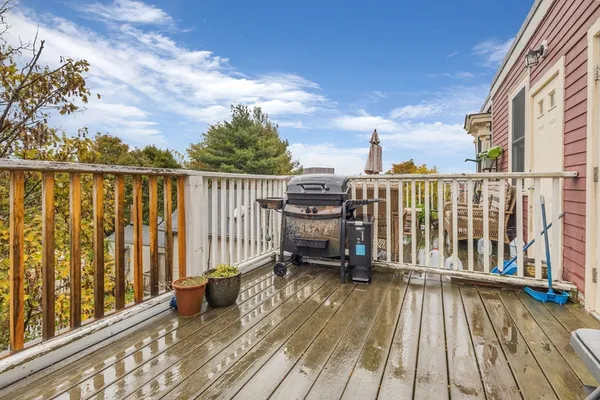 a view of balcony with wooden floor