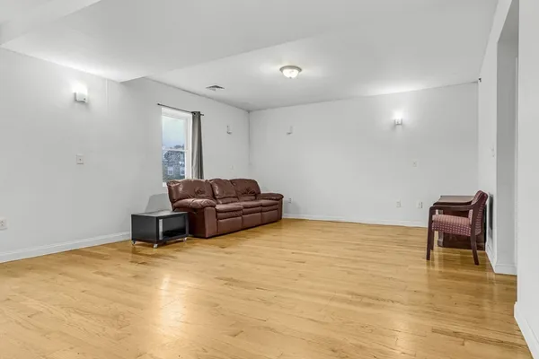 a room with furniture and a wooden floor