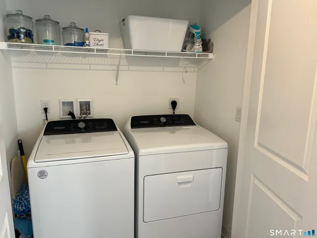 a view of a workspace room with furniture and wooden floor
